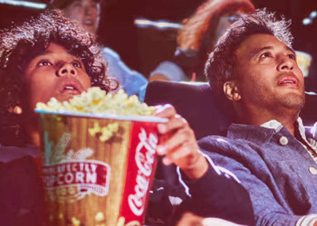 Guests eating popcorn at movie