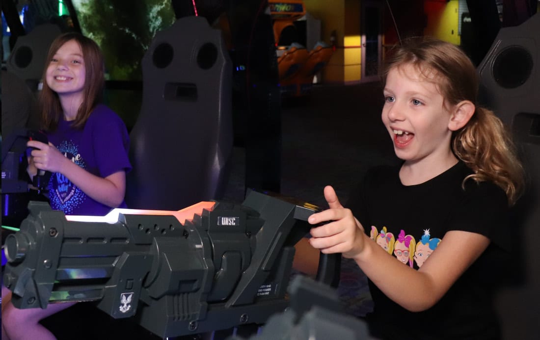 kids playing game at arcade