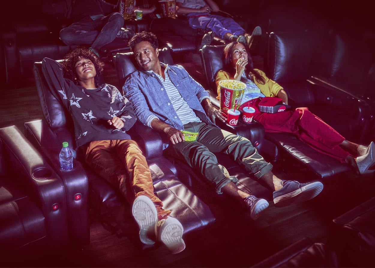 family watching movie at the theatre