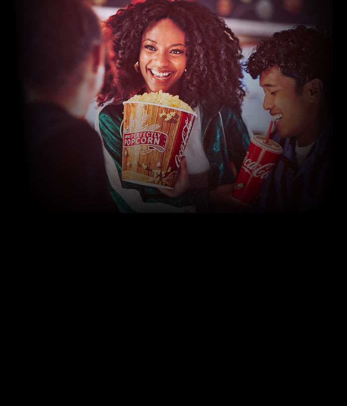 group of friends eating and having drinks at AMC